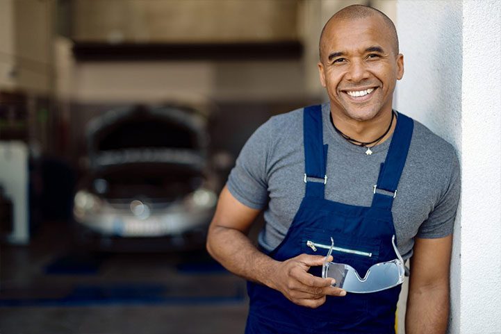 about us happy-african-american-auto-mechanic-repair-shop-scaled