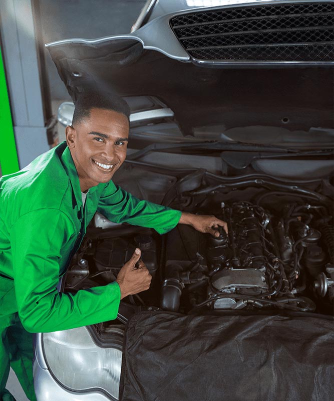 e-car-service-mechanic-showing-thumbs-up-while-repairing-car