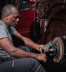 Car Care Tips 2 squeaky brakes car-machanic-checking-and-maintenance-on-car-brakes-e-car-small